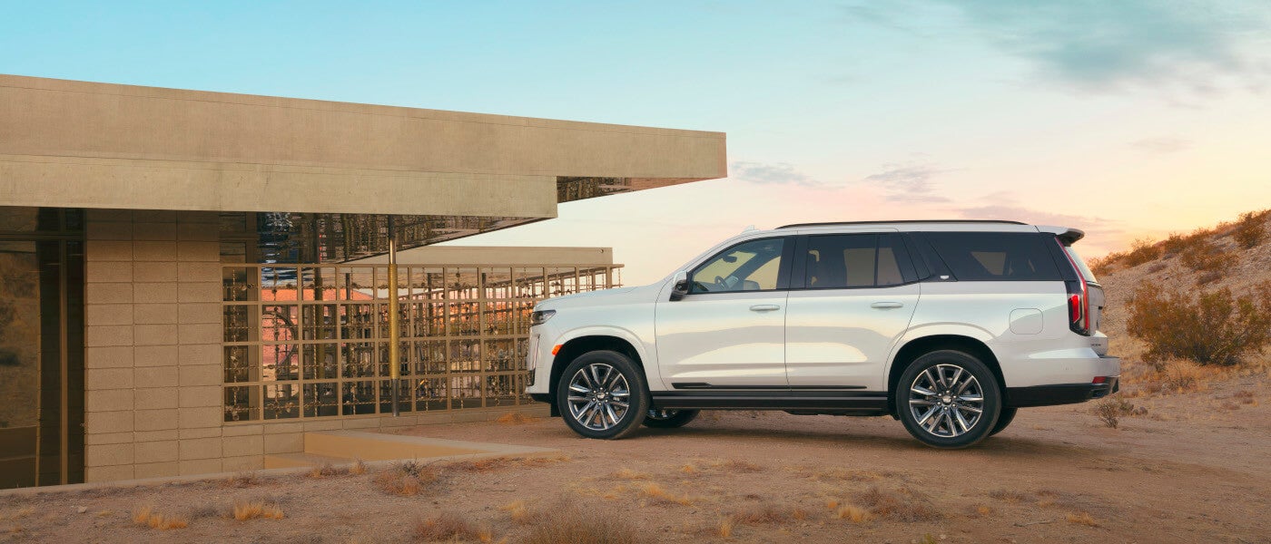 2022 Cadillac Escalade Exterior Parked By A Modern House In The Desert