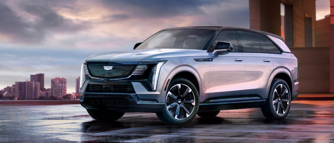 2026 Cadillac Escalade IQ Exterior Parked In Front Of City Skyline