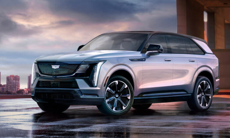 2026 Cadillac ESCALADE IQ Exterior Parked In Front Of City Skyline