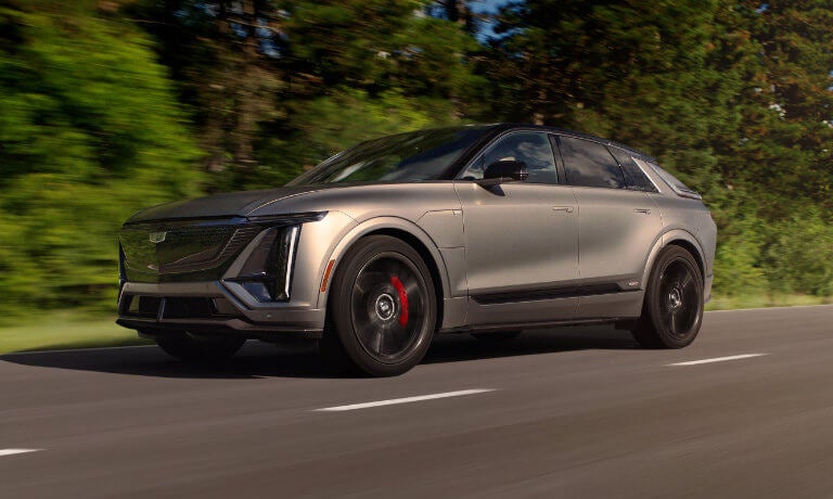 2026 Cadillac LYRIQ Exterior Driving Near Forest
