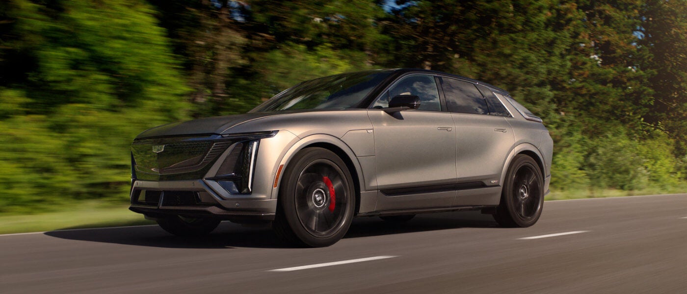 2027 Cadillac LYRIQ Exterior Driving Near Forest